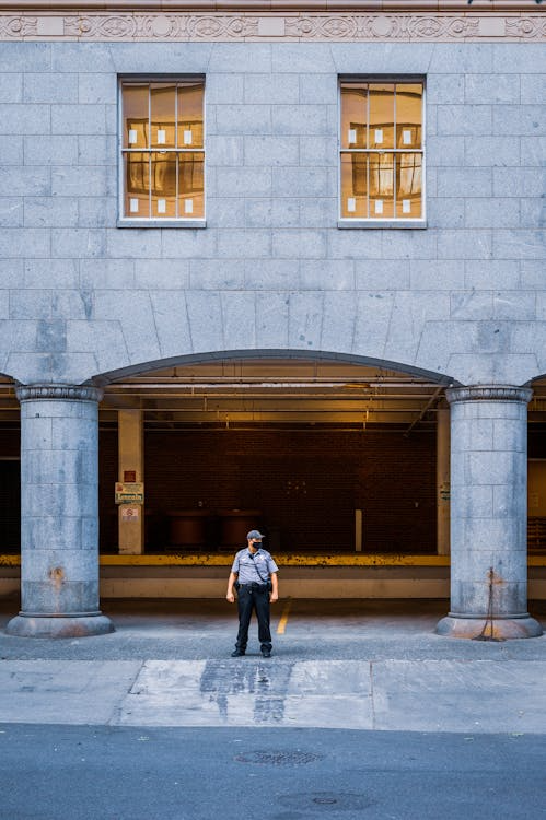 a security guard standing outside a building