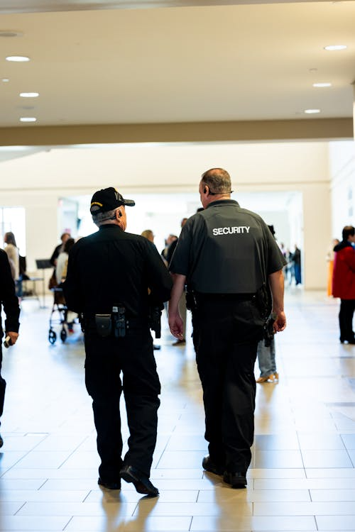 a security personnel patrolling around the indoor mall areas