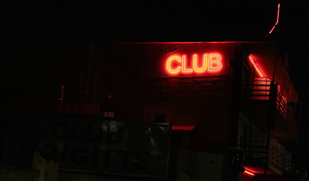 an LED club signage on a wall