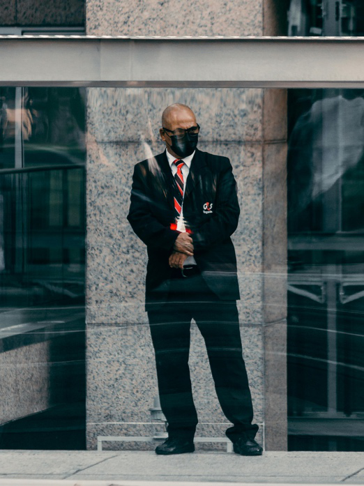 Licensed security guard managing entry at a Leicester venue entrance