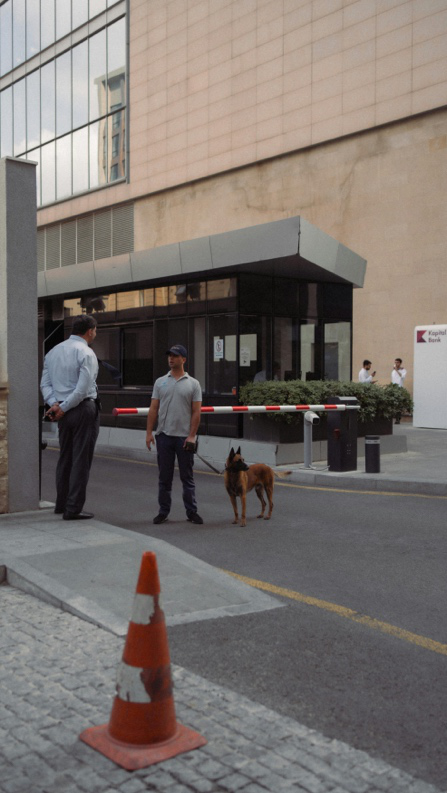 Security guard monitoring a commercial building entrance for safety