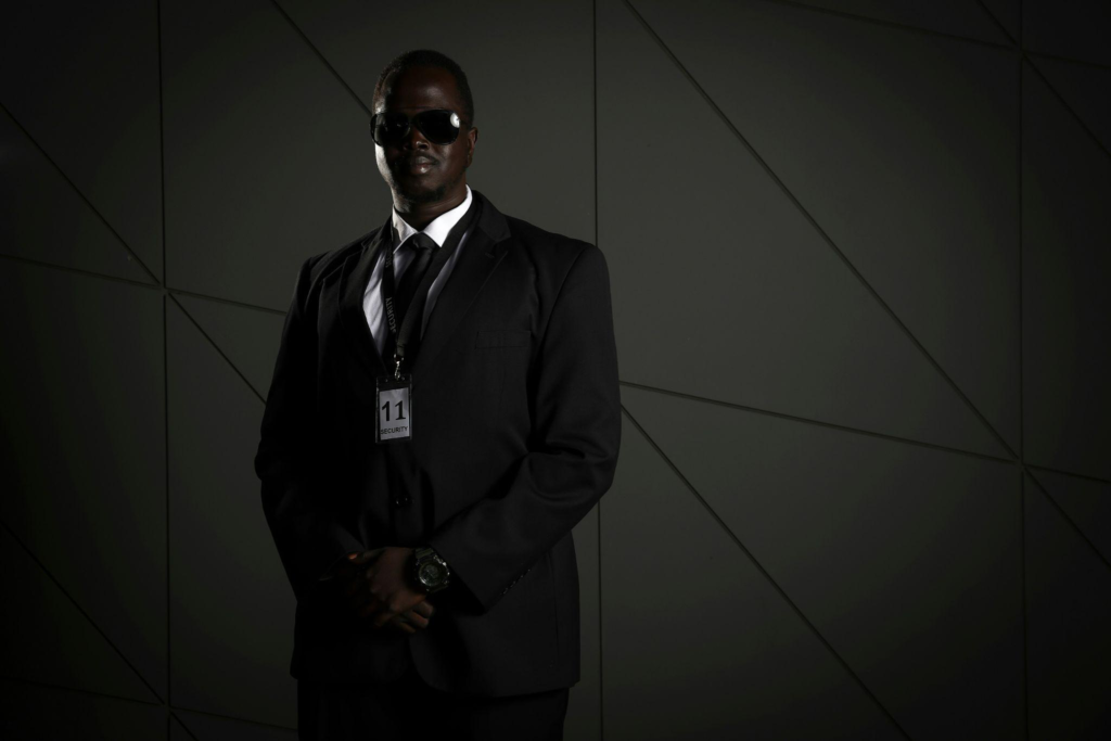 a security guard standing wearing their licence