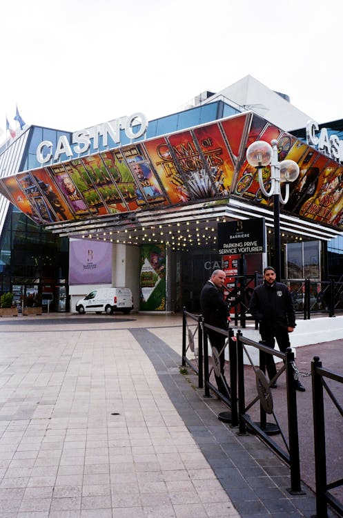Two men standing outside a casino building